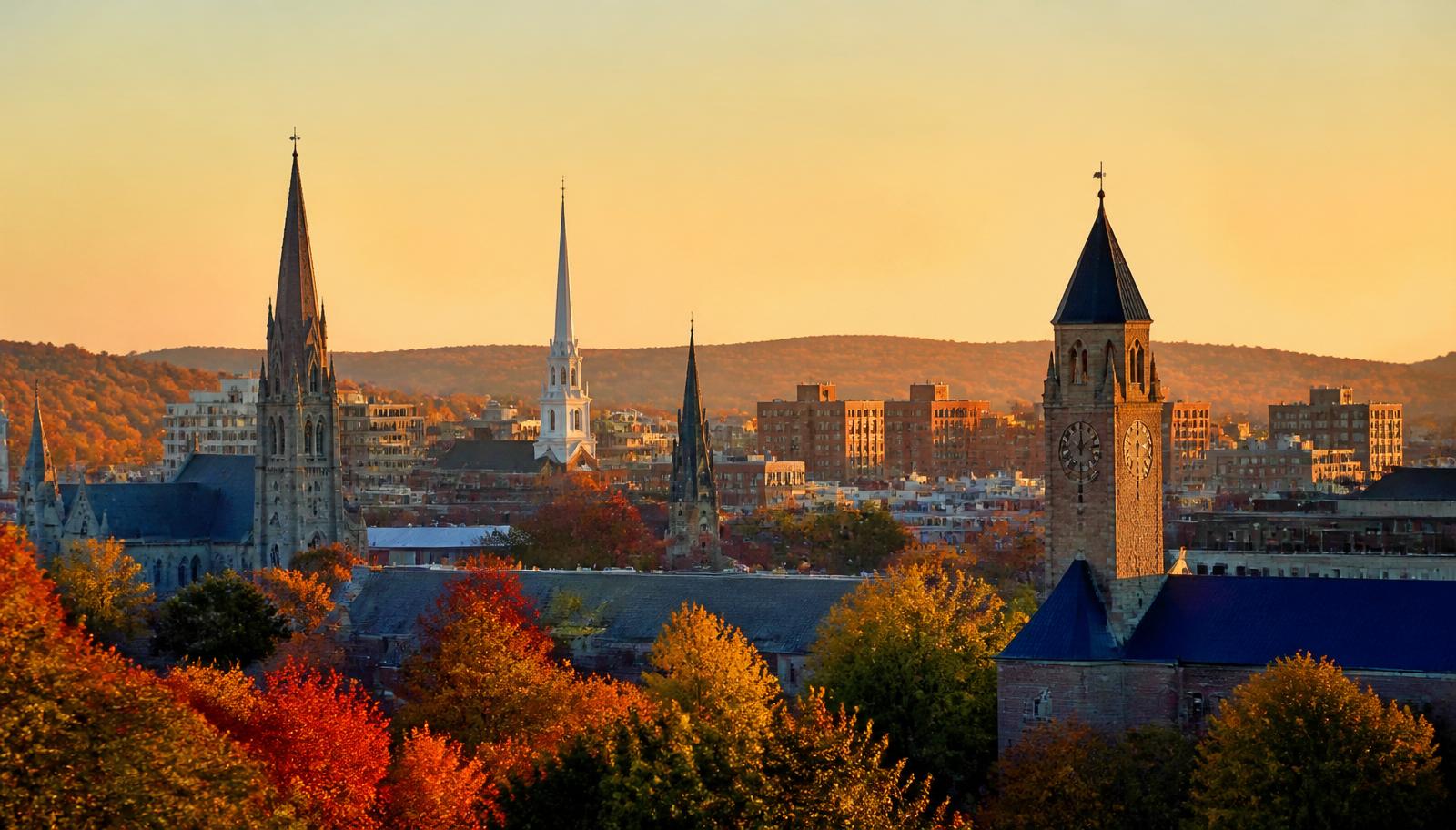 Worcester Massachusetts skyline at golden hour with autumn foliage in the foreground